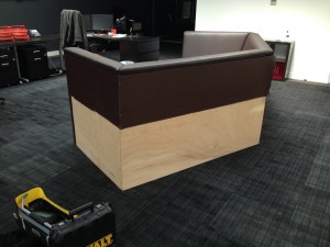 Custom built seating area behind NOC for casual meetings, with a nice technical view
