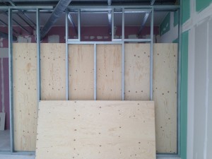 Frontal view of the enclosure as panelling takes shape, with a view of the apertures for air handling