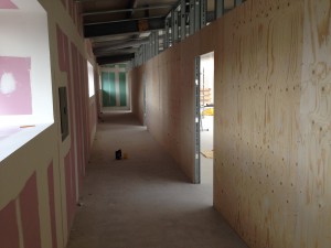 A view inside the cold corridor, as wood panelling nears completion