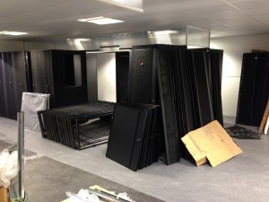 Rack enclosures on the first floor, ahead of assembly