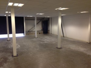 Loading bay / warehouse floor coating preparation underway
