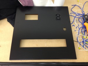 Customised door panel for power distribution enclosure, ahead of assembly